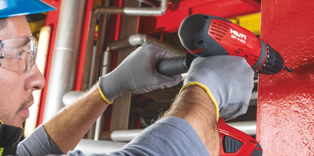 Pilot hole being drilled for an electrical connection